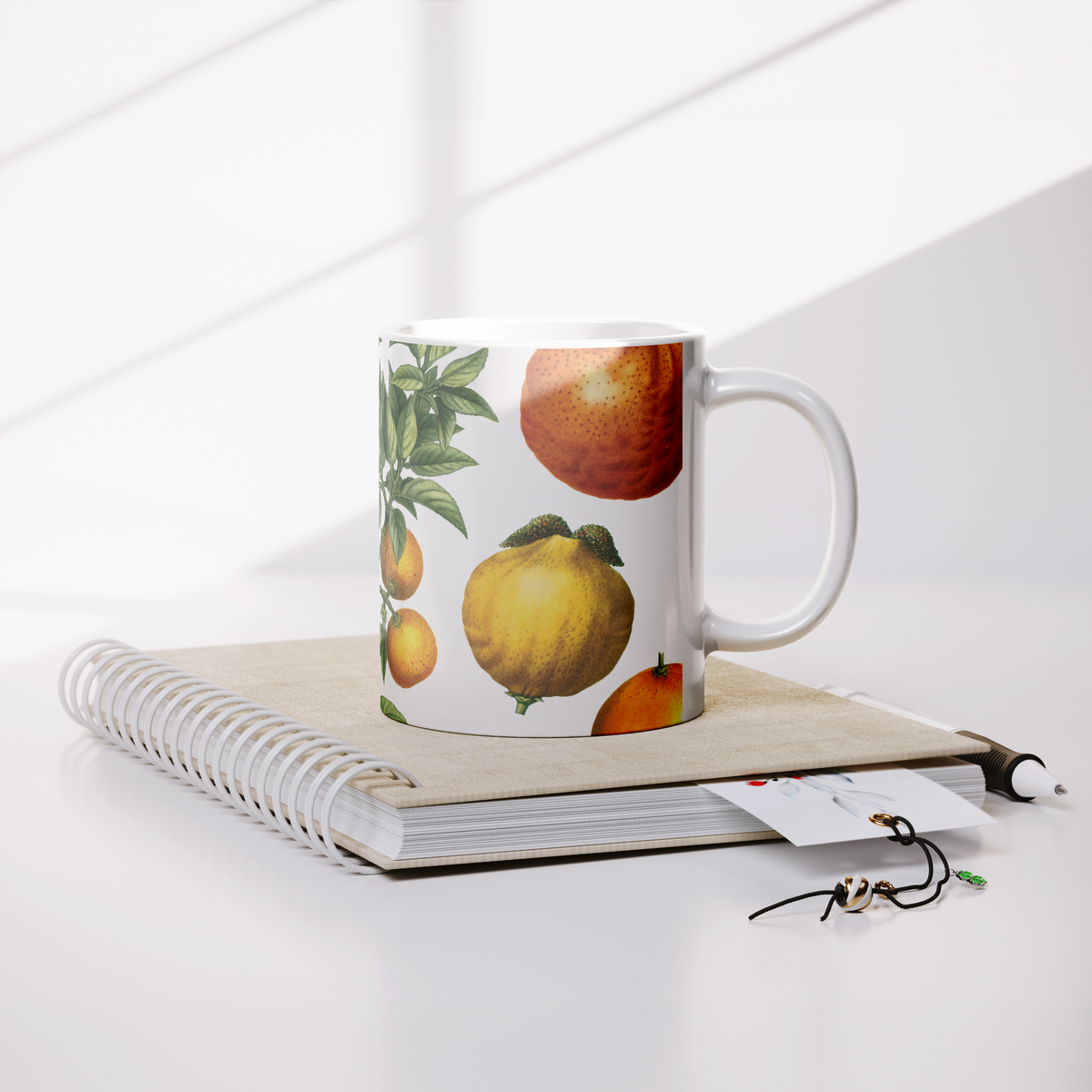Orange_Lemon_Citrus_mug_11oz_Lifestyle_Notebook_Mockup.png_15622751